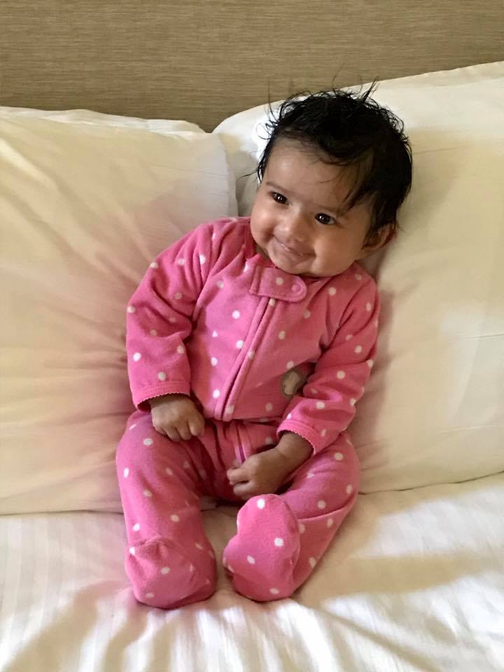 Thea Bhagat smiling at 3 months.