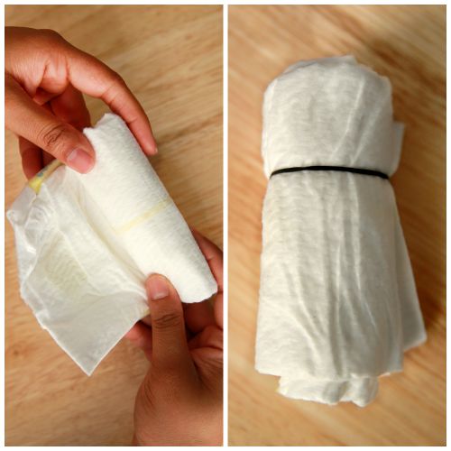 Roll the diapers to make the Diaper Babies as a Baby Shower Gift