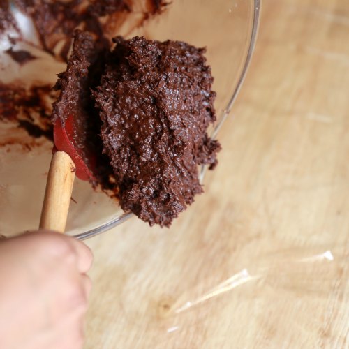 Fold in the dry flour mixture into the wet mixture using a spatula to get the cookie dough