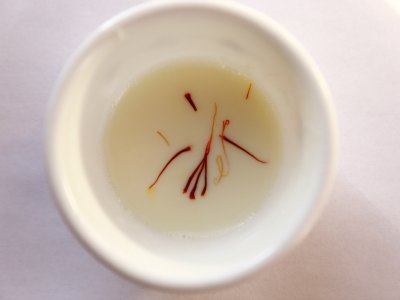 Saffron strands soaked in warm milk