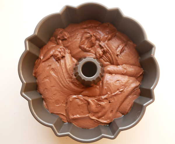 Transfer the chocolate wine cake batter to a greased bundt cake pan.