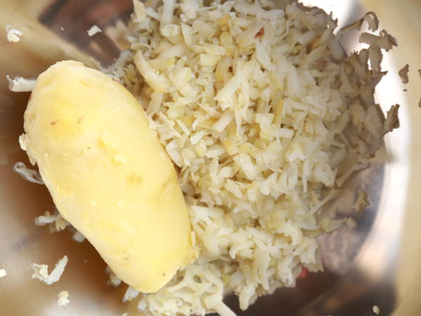 Peel and grate the boiled potato for latke