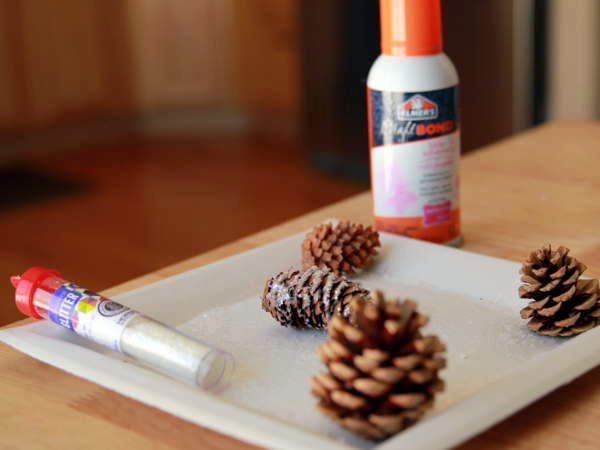 DIY Mason Jar Waterless Snow Globe as party favor for Winter Wonderland Birthday Party Theme.