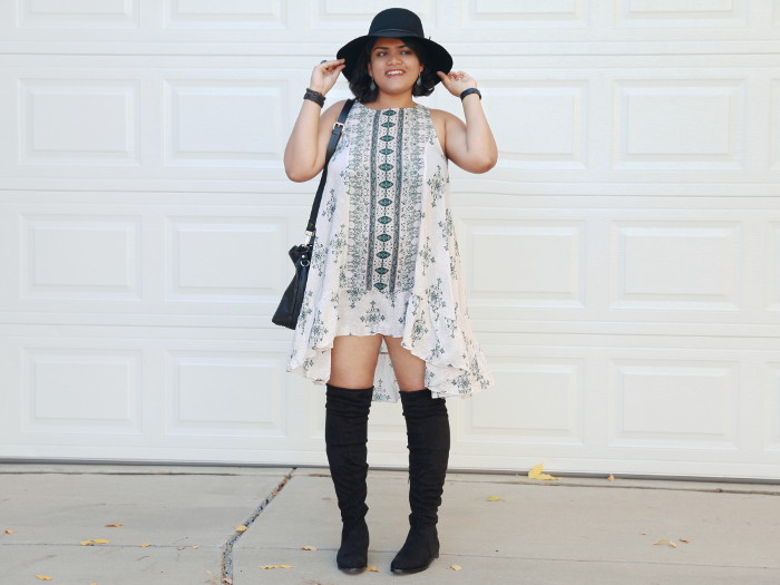 Free People Boho Printed Slip Dress with swingy silhouette and ruffle hem, worn with wool hat and over the knee boots.
