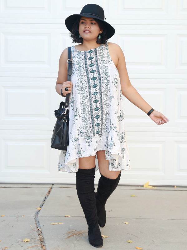 Free People Boho Printed Slip Dress with swingy silhouette and ruffle hem, worn with over the knee boots.
