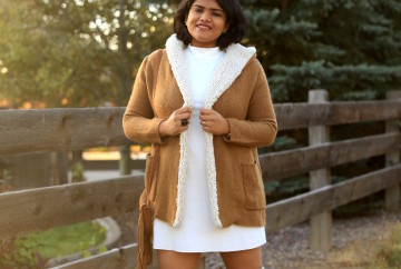 Get cozy in winter, with shades of white and tan. Pair the tan fleece lined coat and suede OTK boots with white mock neck dress.