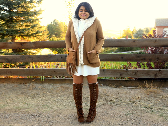 Get cozy in winter, with shades of white and tan. Pair the tan fleece lined coat and suede OTK boots with white mock neck dress. 
