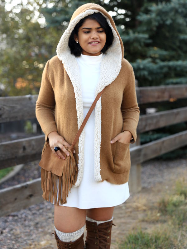 Get cozy in winter, with shades of white and tan. Pair the tan hooded fleece lined coat and suede OTK boots with white mock neck dress. 