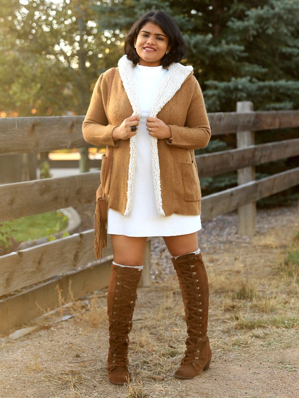 Get cozy in winter, with shades of white and tan. Pair the tan fleece lined coat and suede OTK boots with white mock neck dress. 