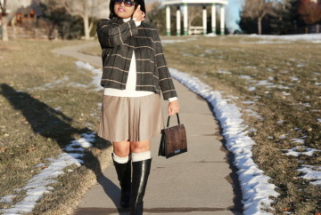 Mix patterns like plaid on plaid. Wearing a fine plaid pleated skirt with big plaid wool blazer.