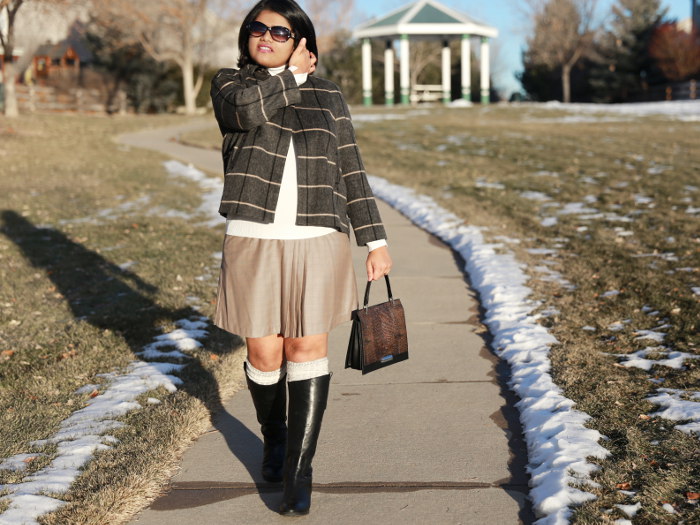 Mix patterns like plaid on plaid. Wearing a fine plaid pleated skirt with big plaid wool blazer.