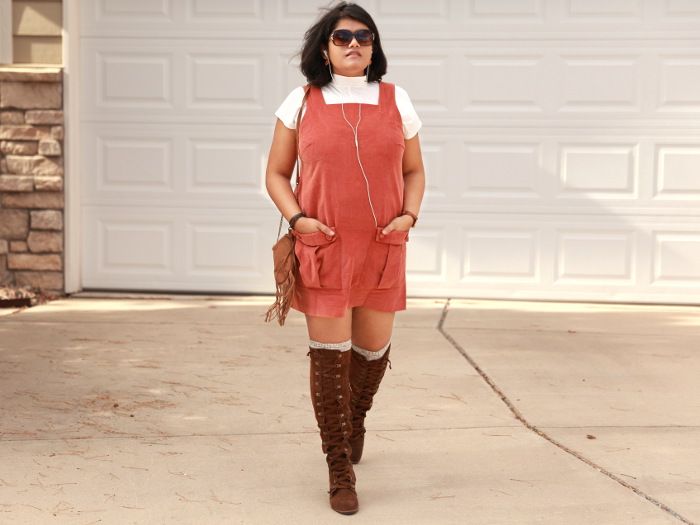 ASOS Orange Corduroy Overall Dress pairs well with a contrasting cream high neck T-shirt.