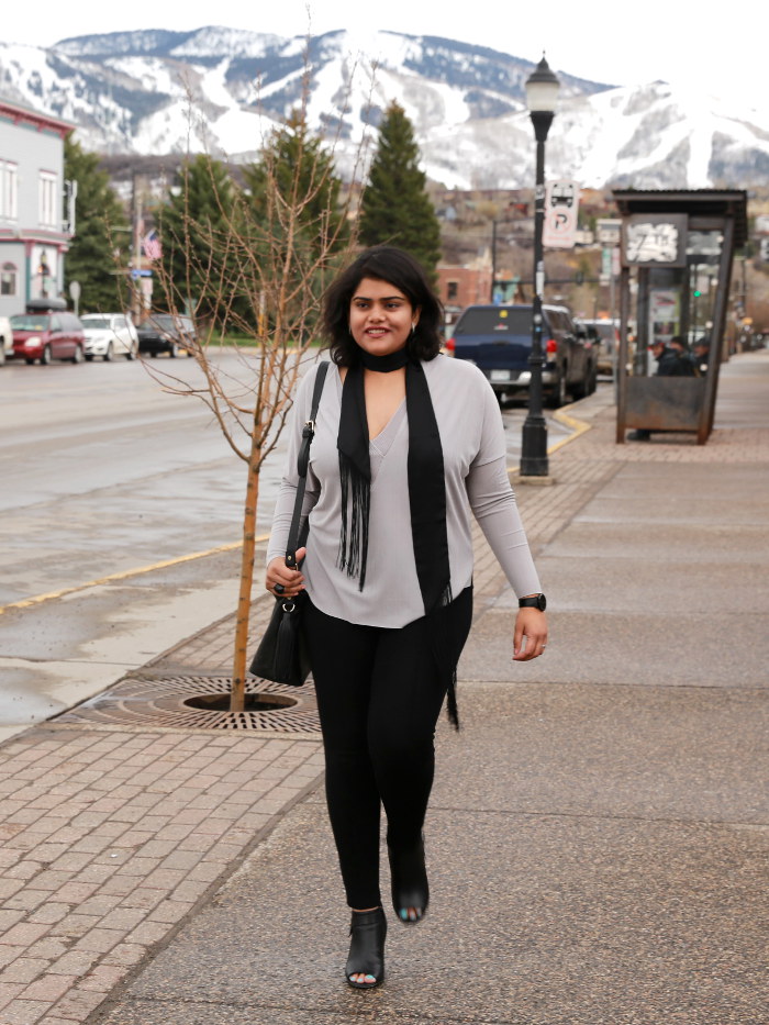 A walk in the downtown Steamboat Springs in relaxed leggings and V-neck top. Wearing a skinny scarf instead of a necklace to give a chic neck coverage.