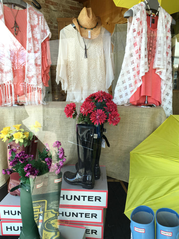 A beautiful window display found while walking in the Downtown Steamboat Springs. How cute are those rainboots being used as a flower vase. The clothes are even cuter.