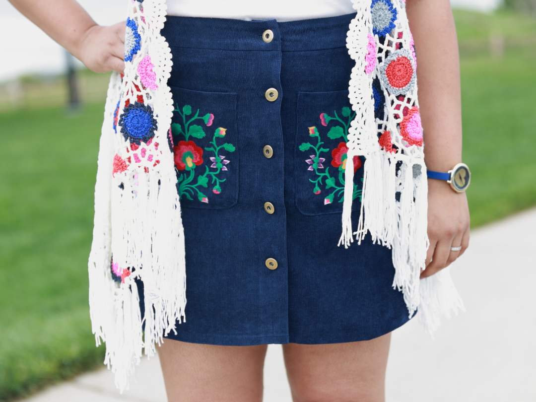 You are your own rainbow. Embroidered Pocket A Line Skirt with Boho Patchwork Crochet Swing Cardigan makes for a vibrant and colorful outfit.